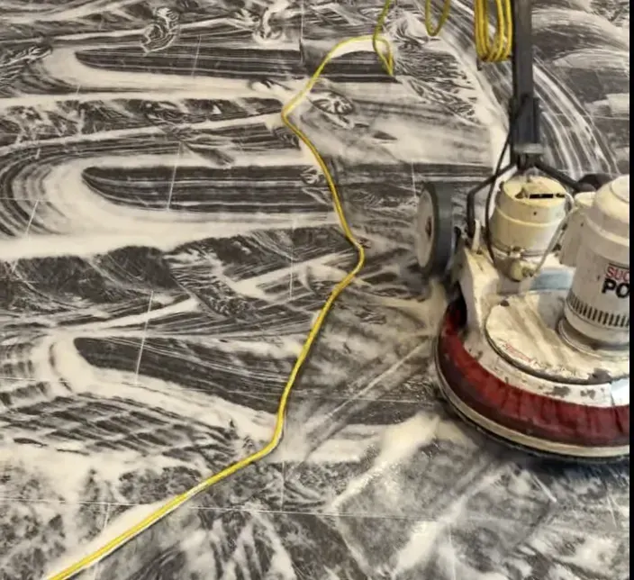 Hard floor cleaning Brisbane: floor scrubbing machine and foam on a tiled commercial floor